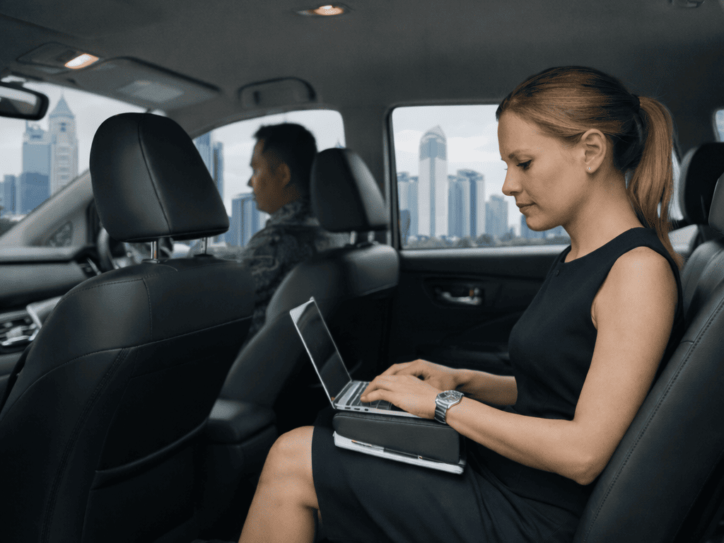 female-executive-working-in-car